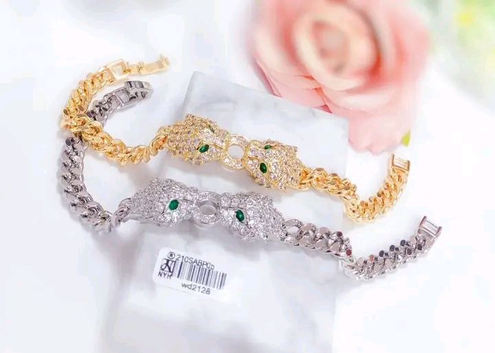 Classic gold and silver bangles for sale at Oshodi